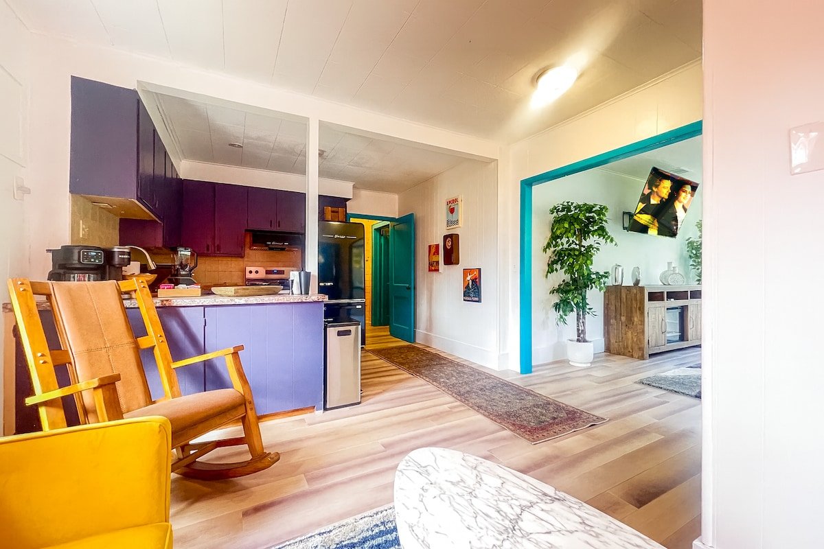 Colorful open-concept living and kitchen area at the three-bedroom Breezy Lawn retreat