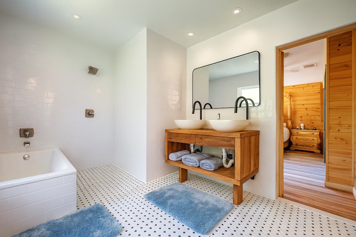Double-vanity bathroom at the three-bedroom Breezy Lawn retreat for easier shared use by groups