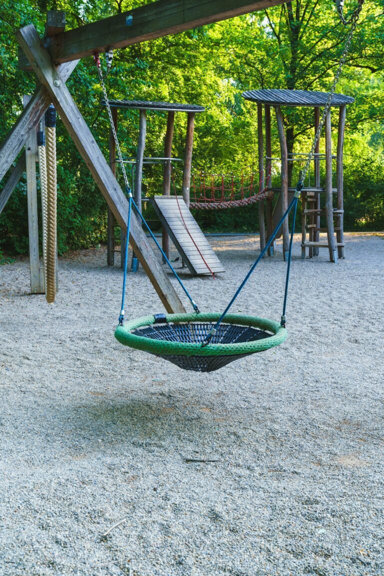 Illustrative children's swings at a park playground; not a specific Hudson Valley attraction