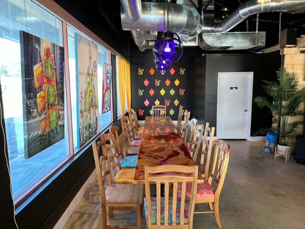 Illustrative long restaurant table arranged for guests; not a photograph of the named Hudson Valley destination