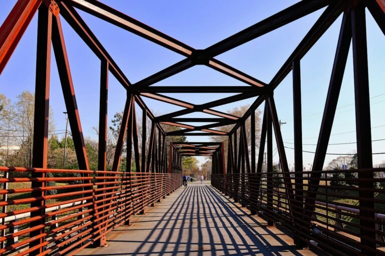 Illustrative long metal truss bridge under blue sky; not a verified photograph of the named Hudson Valley destination