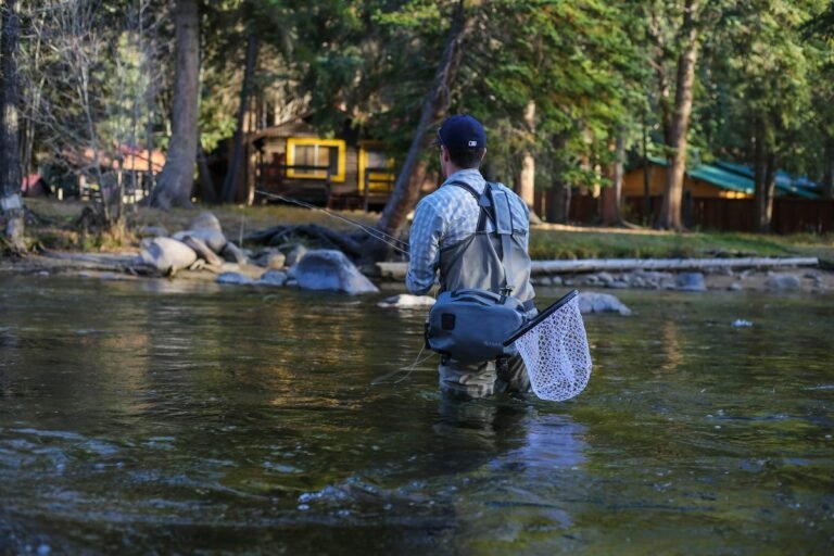 Illustrative angler fly fishing in a river; not a verified photograph of the named Hudson Valley destination