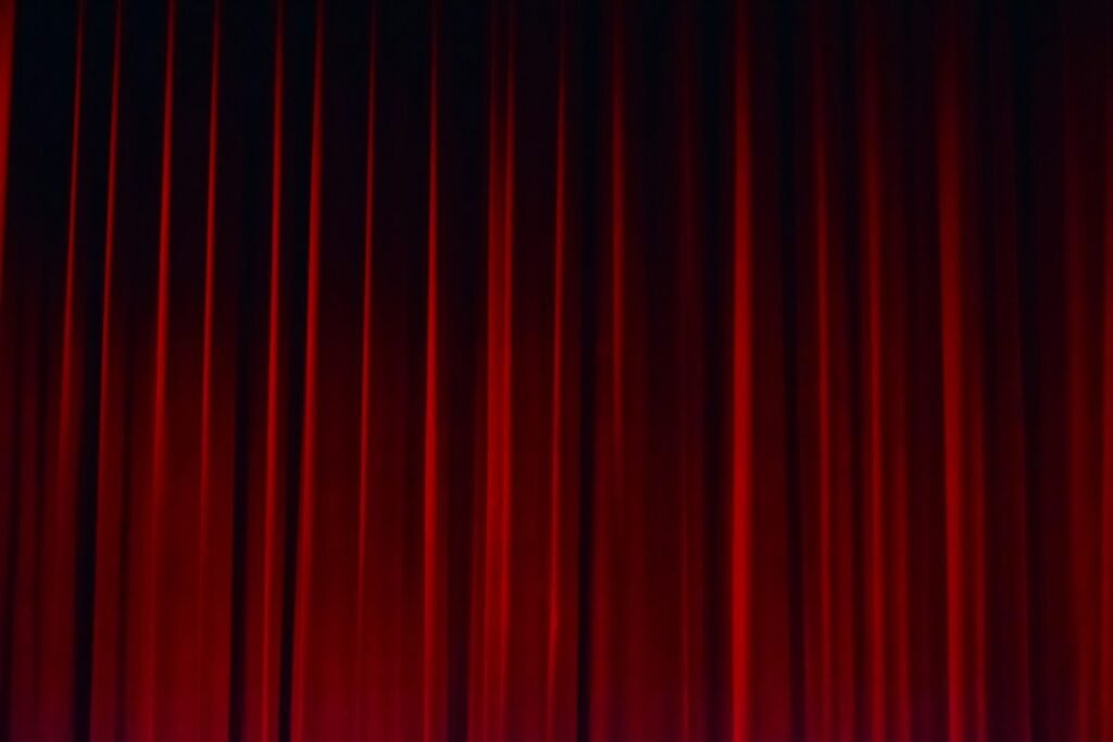 Illustrative red stage curtain in a theater; not a photograph of the named Hudson Valley destination