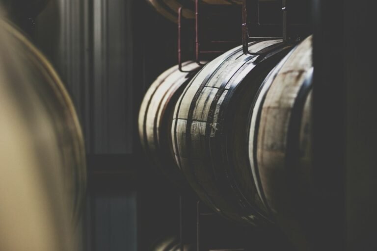 Illustrative distillery barrels, not a photograph of Orange County Distillery