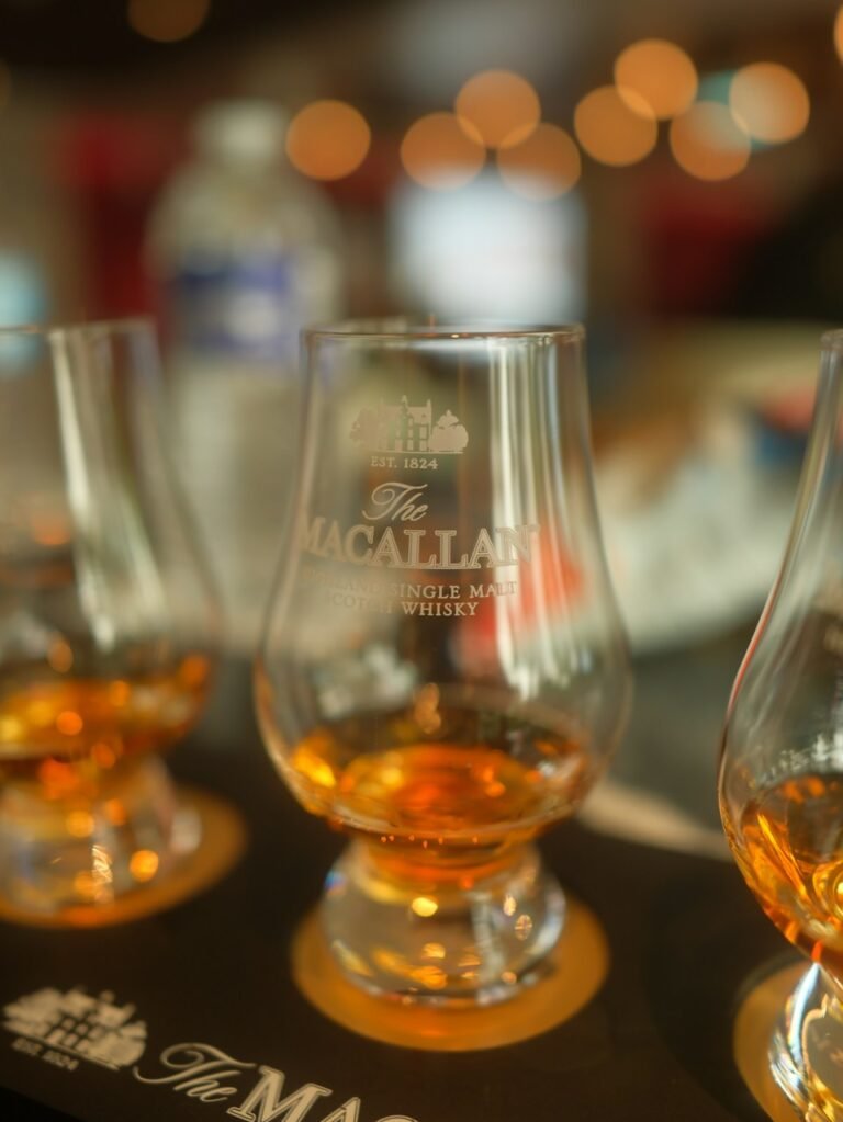 Illustrative whiskey tasting glasses, not a photograph of Speakeasy Motors